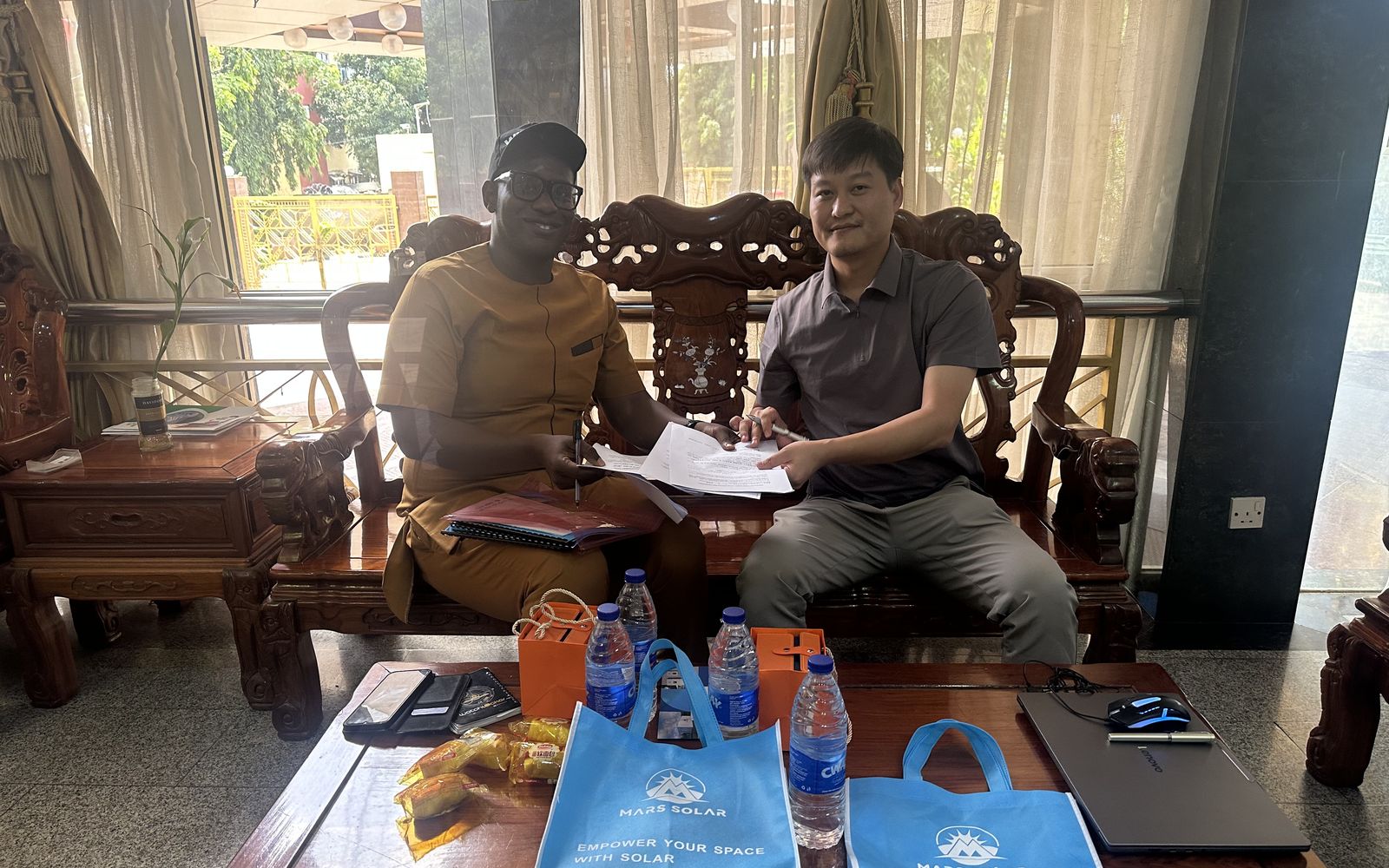 Mars Solar engineer signing a 250kW solar storage system agreement with a Nigerian hotel owner