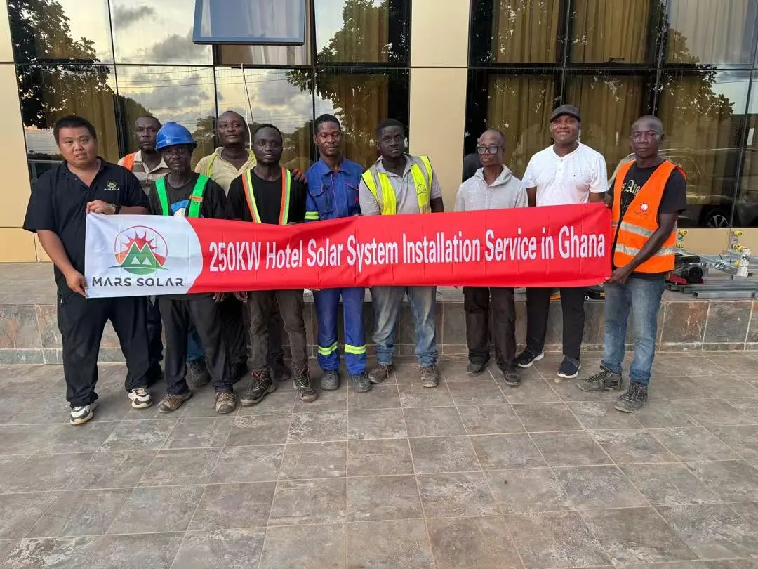 Site photo from the team behind solar system Ghana projects: Our commissioning team on the roof during final torque checks