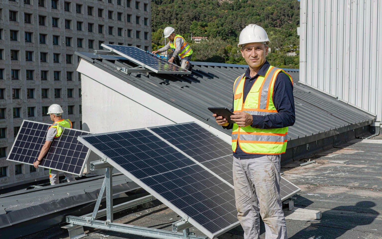Certified installation crew on a rooftop, reliable solar system suppliers deliver their own teams