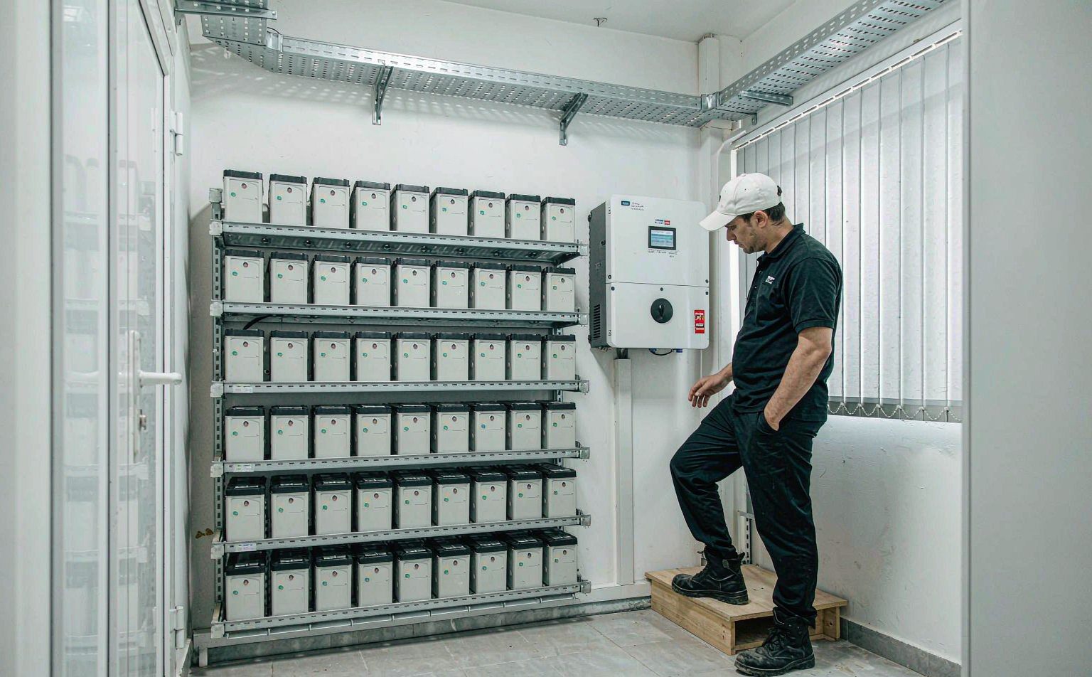 Battery energy storage and hybrid inverter room at a Nigerian hotel that reduced power outage cost for hotels in Nigeria