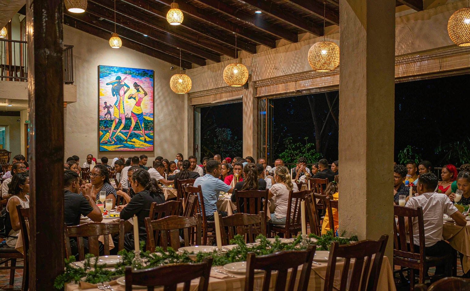 Fully lit hotel restaurant during the December festive peak, the season that maximises power outage cost for hotels in Nigeria