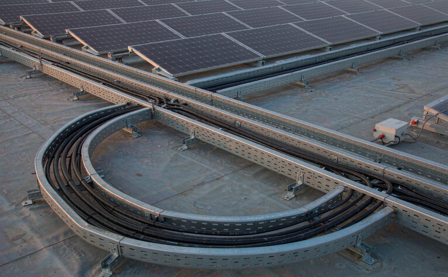 Solar cable trunking on a commercial rooftop with bend radius maintained